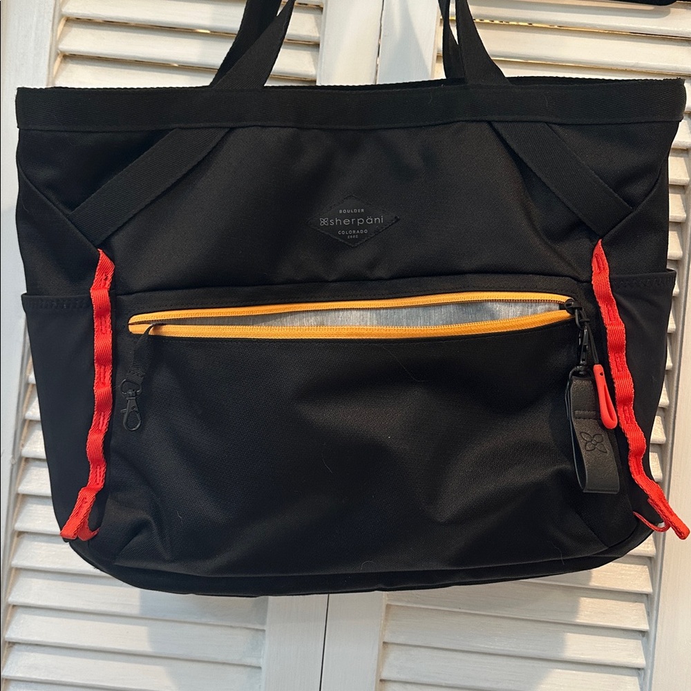 Sherpani Black Tote with Red and Yellow Highlights